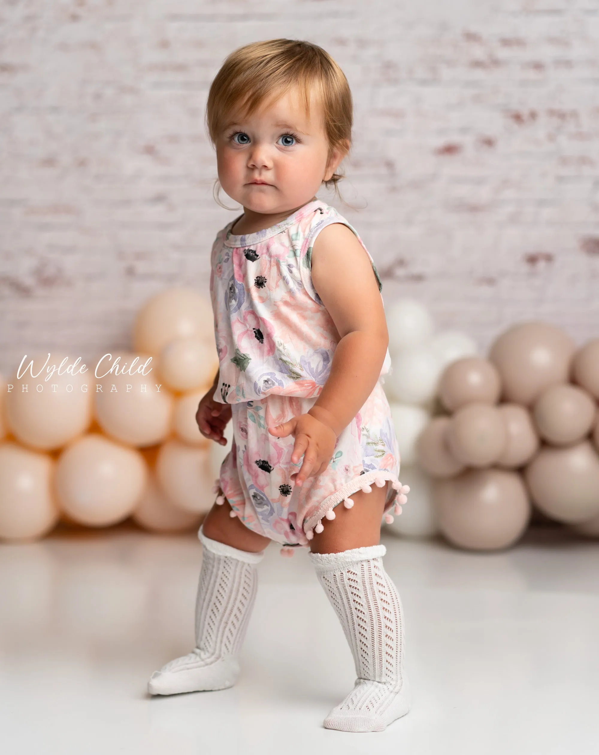 Baby Girls Rainbow Floral Mauve & Peach Pom Pom Romper